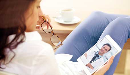 woman visiting doctor via tablet